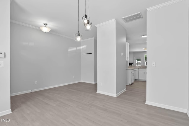 4536 Sugarbend Way, Raleigh, NC 27606 - unfurnished dining area featuring light wood-type flooring and crown molding