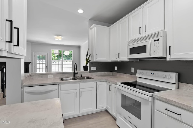 4536 Sugarbend Way, Raleigh, NC 27606 - kitchen featuring white appliances, white cabinets, recessed lighting, light wood-style flooring, and ornamental molding