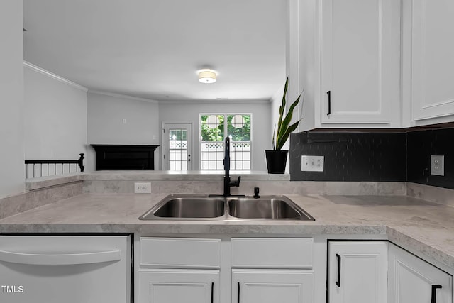 4536 Sugarbend Way, Raleigh, NC 27606 - kitchen with white dishwasher, ornamental molding, white cabinetry, light countertops, and a fireplace