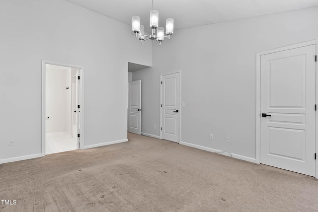 4536 Sugarbend Way, Raleigh, NC 27606 - spare room with a chandelier, carpet, and a high ceiling