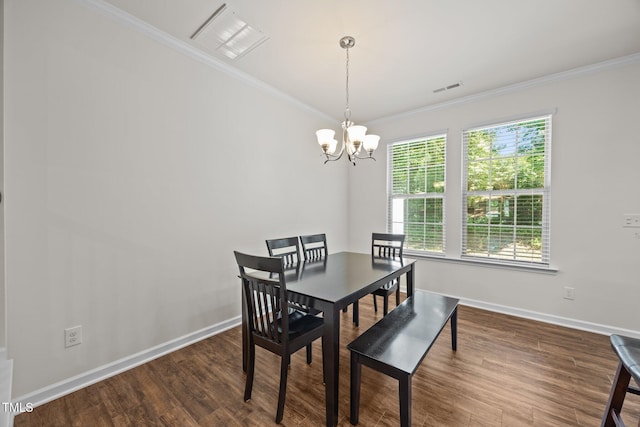3810 Prince Noah Loop, Wake Forest, NC 27587 - dining area featuring dark wood finished floors, crown molding, and a chandelier