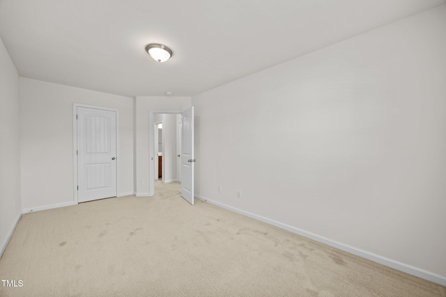 3810 Prince Noah Loop, Wake Forest, NC 27587 - unfurnished bedroom with baseboards and light carpet