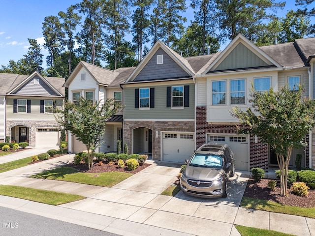 3810 Prince Noah Loop, Wake Forest, NC 27587 - view of property featuring driveway, a garage, stone siding, and board and batten siding