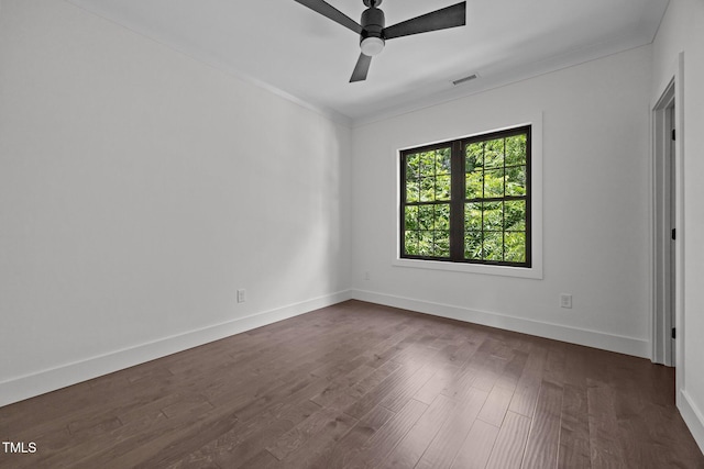 1317 Fay St, Durham, NC 27701 - unfurnished bedroom with crown molding, dark wood-style floors, and ceiling fan