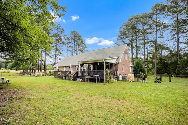 100 Martindale Dr, Youngsville, NC 27596 - back of house with brick siding and a wooden deck