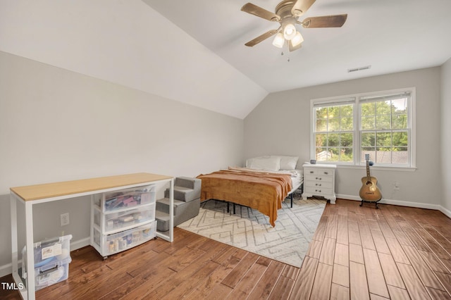 100 Martindale Dr, Youngsville, NC 27596 - bedroom with wood finished floors, vaulted ceiling, and a ceiling fan