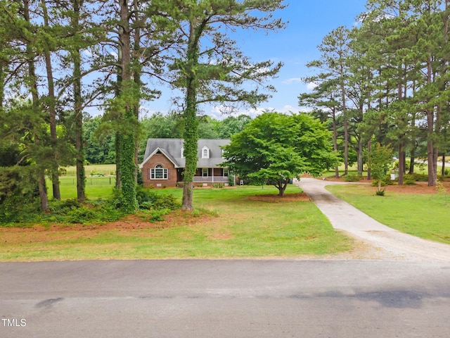 100 Martindale Dr, Youngsville, NC 27596 - view of property hidden behind natural elements featuring a front lawn and driveway