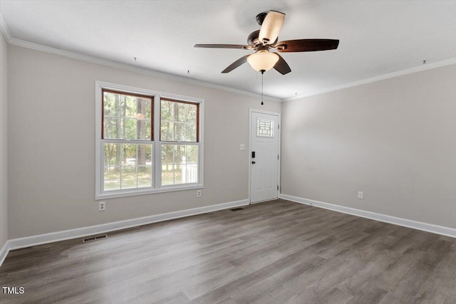 136 Dixie Ln, Youngsville, NC 27596 - spare room with wood finished floors, ceiling fan, and ornamental molding