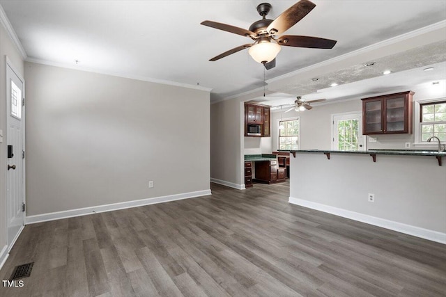 136 Dixie Ln, Youngsville, NC 27596 - unfurnished living room featuring ornamental molding, ceiling fan, dark wood-style floors, and recessed lighting