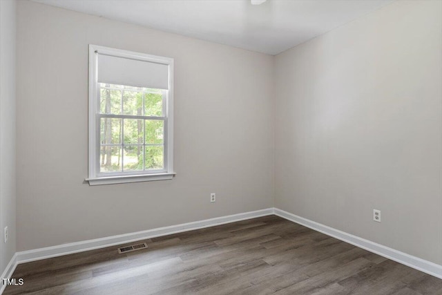 136 Dixie Ln, Youngsville, NC 27596 - unfurnished room featuring dark wood finished floors and baseboards