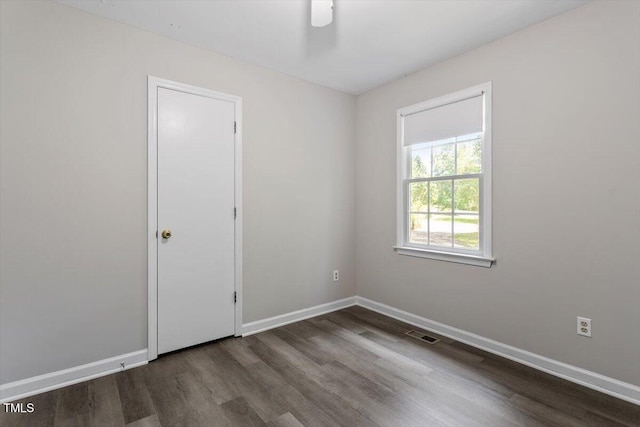 136 Dixie Ln, Youngsville, NC 27596 - empty room featuring dark wood finished floors and baseboards