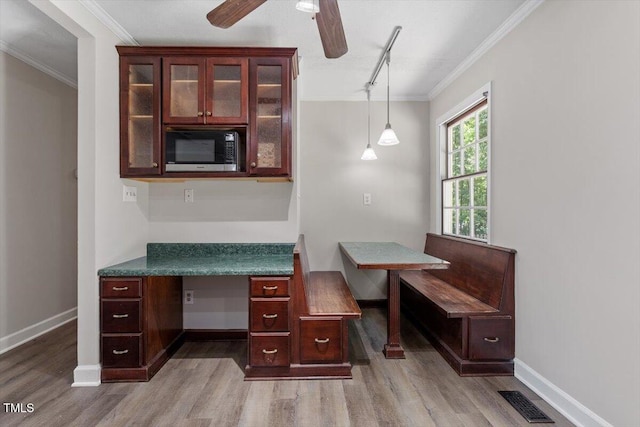 136 Dixie Ln, Youngsville, NC 27596 - home office with wood finished floors, ornamental molding, track lighting, and a ceiling fan