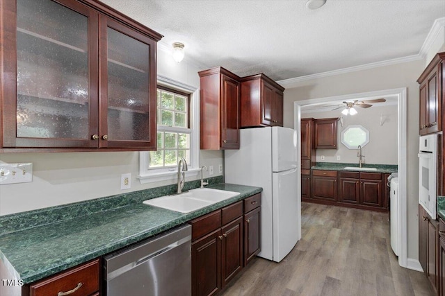 136 Dixie Ln, Youngsville, NC 27596 - kitchen featuring white appliances, dark wood finished floors, dark countertops, glass insert cabinets, and ceiling fan