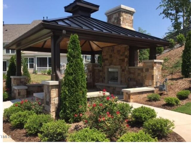 610 Chronicle Dr, Cary, NC 27513 - view of patio with a gazebo and an outdoor stone fireplace