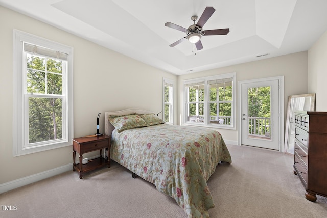 610 Chronicle Dr, Cary, NC 27513 - bedroom with a raised ceiling, multiple windows, light colored carpet, and access to outside