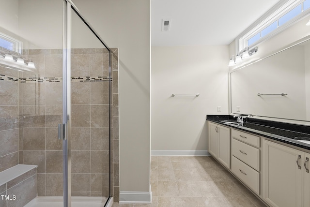 610 Chronicle Dr, Cary, NC 27513 - bathroom with double vanity, a stall shower, and healthy amount of natural light