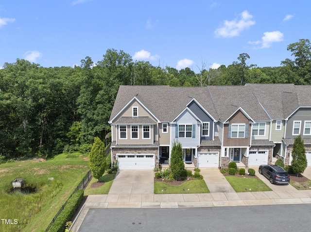 610 Chronicle Dr, Cary, NC 27513 - view of property with stone siding, concrete driveway, and a garage