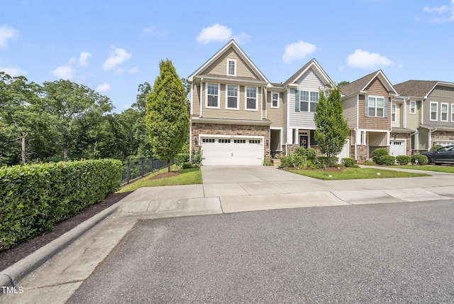 610 Chronicle Dr, Cary, NC 27513 - view of front of property featuring concrete driveway, stone siding, and a garage