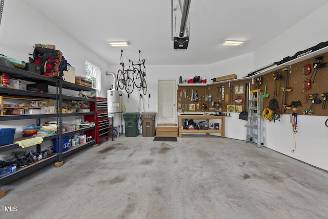 610 Chronicle Dr, Cary, NC 27513 - garage featuring a workshop area, water heater, and a garage door opener