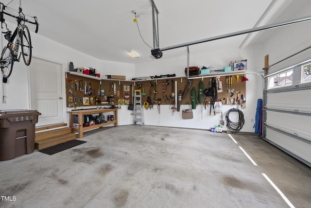 610 Chronicle Dr, Cary, NC 27513 - garage featuring a workshop area and a garage door opener