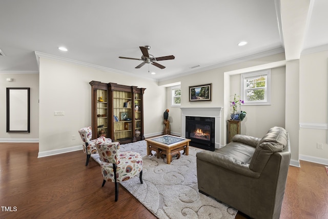 610 Chronicle Dr, Cary, NC 27513 - living room featuring a glass covered fireplace, wood finished floors, healthy amount of natural light, ceiling fan, and recessed lighting