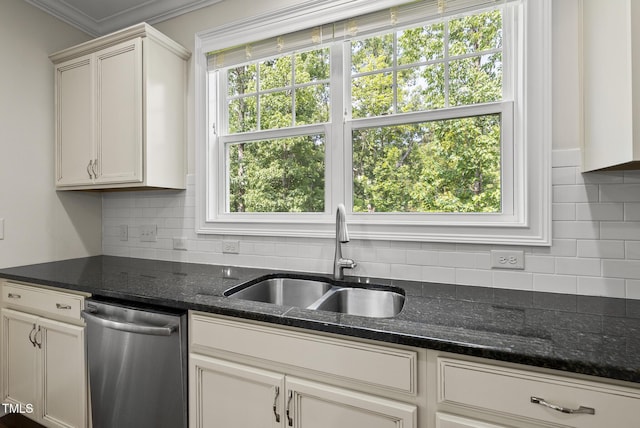 610 Chronicle Dr, Cary, NC 27513 - kitchen with stainless steel dishwasher, backsplash, dark stone countertops, ornamental molding, and white cabinetry