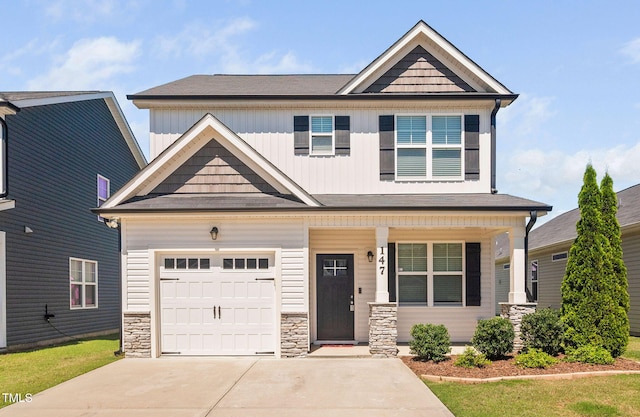 147 Sunfish St, Smithfield, NC 27577 - craftsman-style house with driveway, covered porch, and stone siding