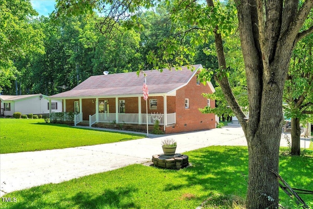 140 Maryland Dr, Manson, NC 27553 - single story home featuring a porch, concrete driveway, crawl space, brick siding, and a front yard