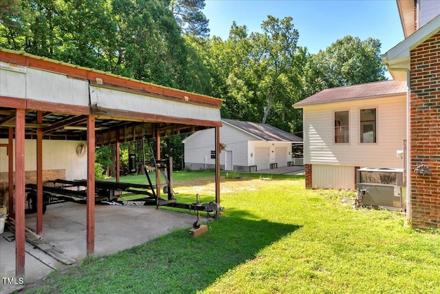 140 Maryland Dr, Manson, NC 27553 - view of grassy yard with a patio area and a carport