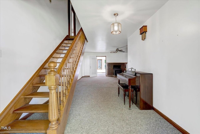 140 Maryland Dr, Manson, NC 27553 - stairs with carpet floors, a brick fireplace, and a ceiling fan