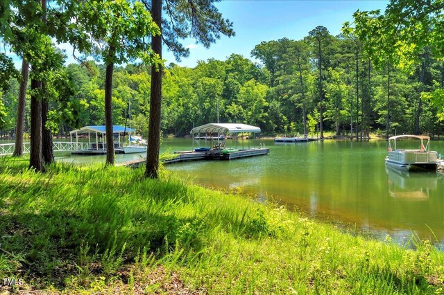 140 Maryland Dr, Manson, NC 27553 - water view featuring a floating dock and a heavily wooded area