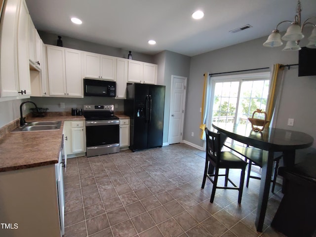 650 Ganyard Farm Way Unit 32, Durham, NC 27703 - kitchen with black appliances, white cabinetry, recessed lighting, a chandelier, and stone finish flooring