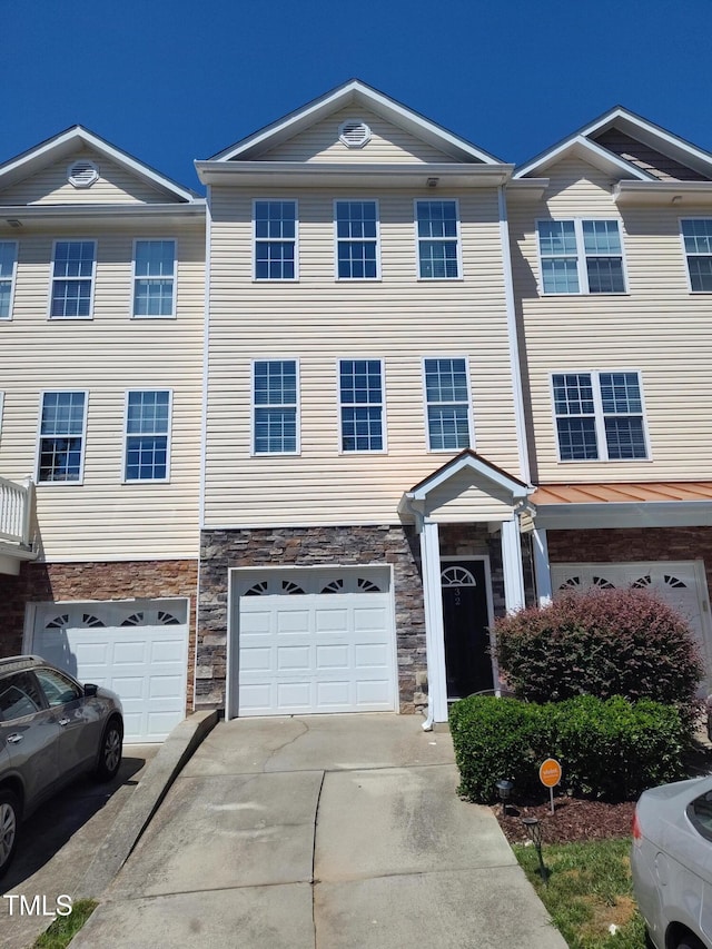 650 Ganyard Farm Way Unit 32, Durham, NC 27703 - townhome / multi-family property featuring concrete driveway, an attached garage, and stone siding