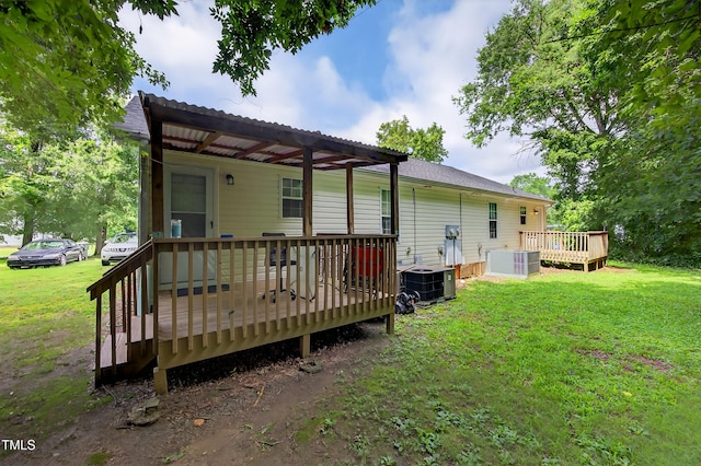 308 E Gilbreath St, Graham, NC 27253 - rear view of property with a deck and a yard