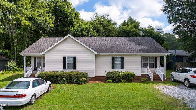 308 E Gilbreath St, Graham, NC 27253 - view of front of property with crawl space, a shingled roof, and a front lawn