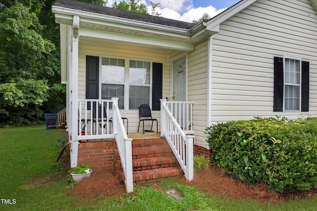 308 E Gilbreath St, Graham, NC 27253 - entrance to property with a porch and a lawn