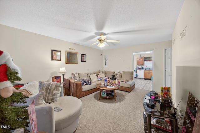 308 E Gilbreath St, Graham, NC 27253 - carpeted living room featuring ceiling fan and a textured ceiling