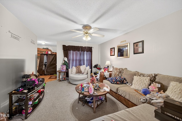 308 E Gilbreath St, Graham, NC 27253 - carpeted living area with ceiling fan and a textured ceiling