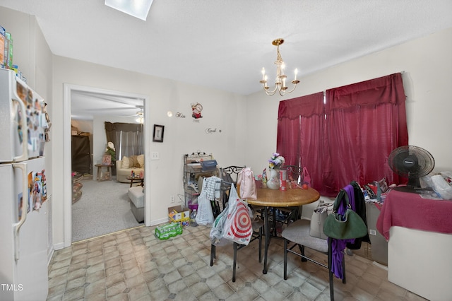 308 E Gilbreath St, Graham, NC 27253 - dining area featuring tile patterned floors and a chandelier