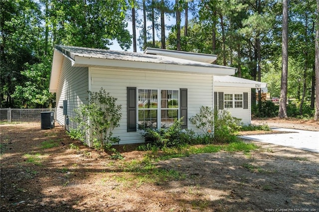 12741 Birchwood Cir, Laurinburg, NC 28352 - view of home's exterior featuring a central AC unit and a metal roof