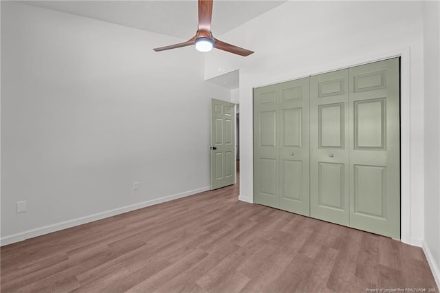 12741 Birchwood Cir, Laurinburg, NC 28352 - unfurnished bedroom with wood finished floors, a closet, and a ceiling fan