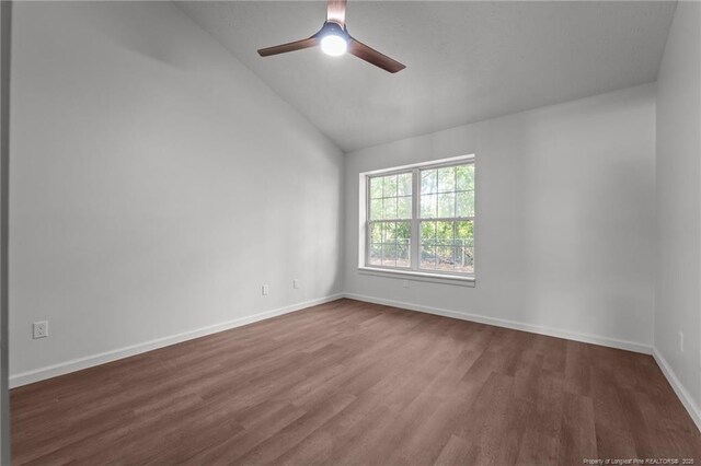 12741 Birchwood Cir, Laurinburg, NC 28352 - empty room with lofted ceiling, dark wood-style floors, and ceiling fan