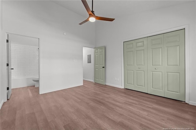 12741 Birchwood Cir, Laurinburg, NC 28352 - unfurnished bedroom featuring wood finished floors, electric panel, a closet, connected bathroom, and ceiling fan
