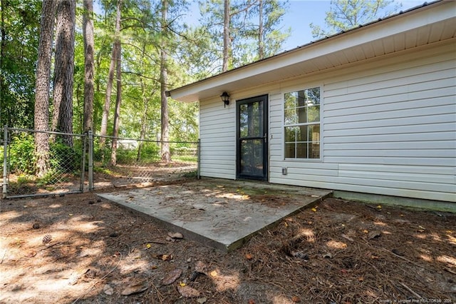 12741 Birchwood Cir, Laurinburg, NC 28352 - view of exterior entry featuring a patio