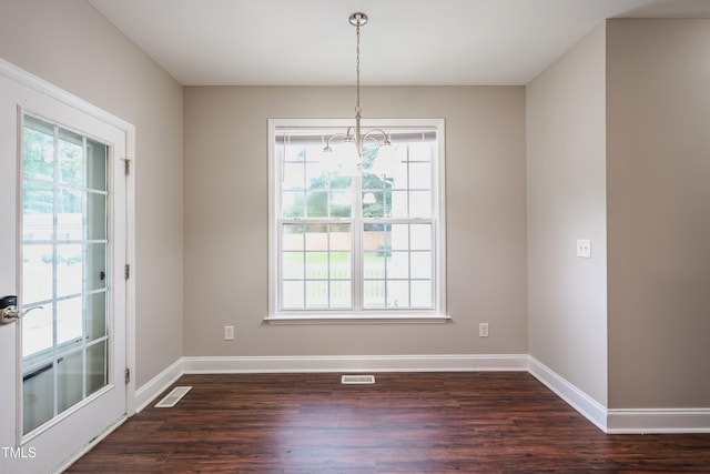 2430 Josephine Rd, Garner, NC 27529 - unfurnished dining area with a chandelier, plenty of natural light, and dark wood-style floors