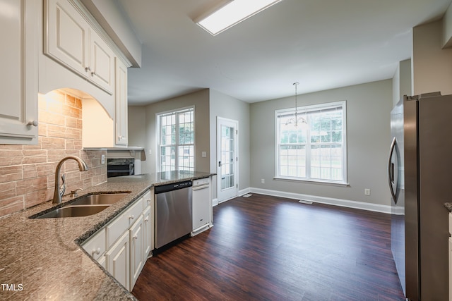 2430 Josephine Rd, Garner, NC 27529 - kitchen with appliances with stainless steel finishes, dark wood-style flooring, healthy amount of natural light, and light stone counters
