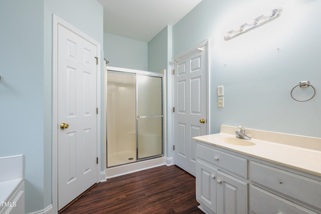 2430 Josephine Rd, Garner, NC 27529 - bathroom with a stall shower, wood finished floors, and vanity