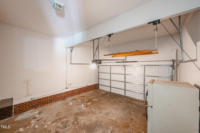 2430 Josephine Rd, Garner, NC 27529 - garage with freestanding refrigerator, washer / dryer, and a garage door opener