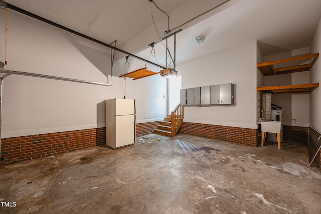 2430 Josephine Rd, Garner, NC 27529 - garage featuring freestanding refrigerator and a garage door opener