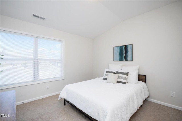 1125 Russet Ln, Apex, NC 27523 - carpeted bedroom featuring vaulted ceiling and baseboards